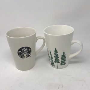 Two Starbucks coffee mugs One is Christmas edition